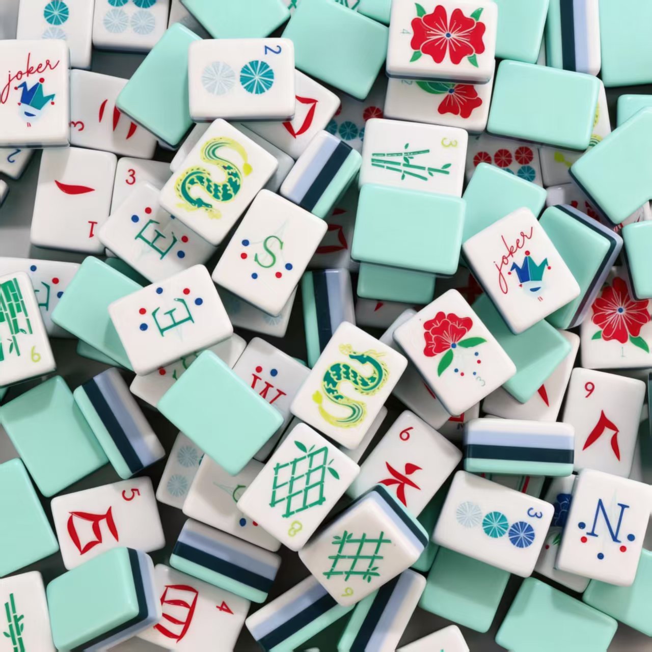 Mint green American Mahjong set tiles arranged in rows