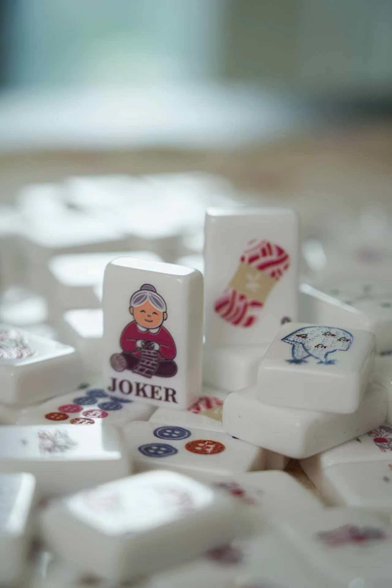 Cute American Mahjong Set - joker tiles and number tiles close up on marble surface