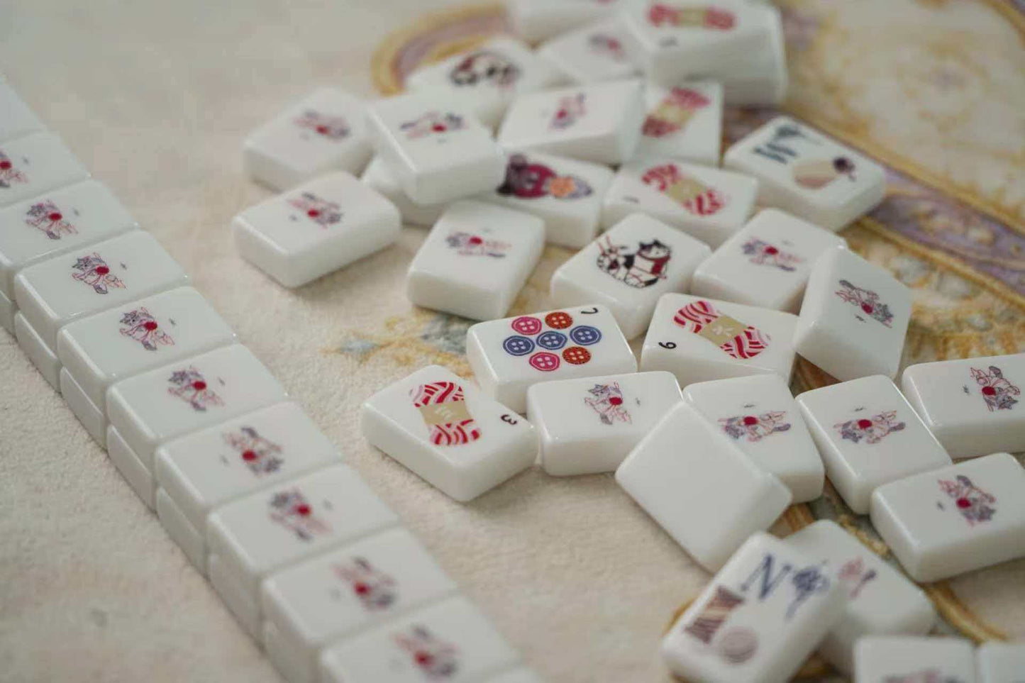 Cute American Mahjong Set - tiles scattered showing full variety of whimsical illustrations